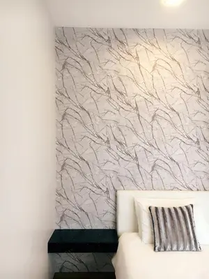 a wall mural in a living room with a white couch at Shamrock Boutique Villa - Stay for 12 person in Batu Ferringhi