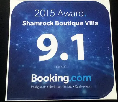 a sign for a thermometer with the number at Shamrock Boutique Villa - Stay for 12 person in Batu Ferringhi