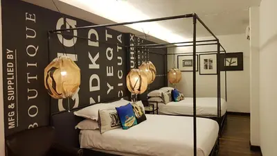 a room with two bunk beds in a room at M Boutique Hotel Station 18 - Ipoh in Ipoh