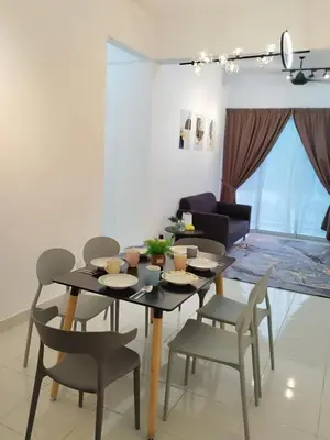 a dining room with a table and chairs at Kampar Lake House - Bandar Baru Kampar City Centre in Kampar