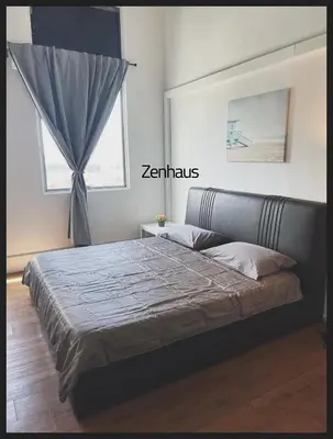 a bedroom with a large bed with a window at THE CEO LOFT by Zenhaus in Bayan Lepas