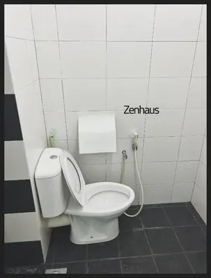 a bathroom with a white toilet in a stall at THE CEO LOFT by Zenhaus in Bayan Lepas