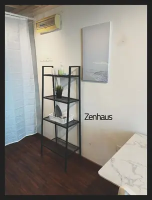 a black shelf with a plant on it in a room at THE CEO LOFT by Zenhaus in Bayan Lepas