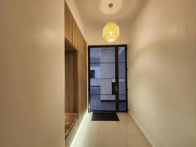 a hallway with a door leading into a room at Georgetown Modern CosyStay in George Town