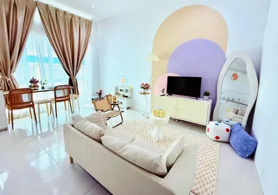 a living room with a couch and a tv at Mimi 1 Bedroom Studio House Homestay in Gerik