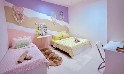 a childs bedroom with a bed and a couch at Mimi 1 Bedroom Studio House Homestay in Gerik