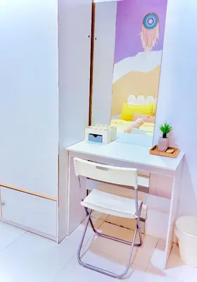 a dressing table with a chair and a mirror at Mimi 1 Bedroom Studio House Homestay in Gerik