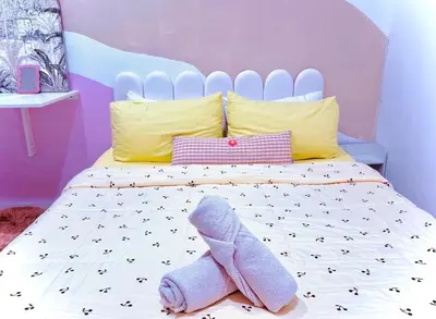 a bedroom with a bed with a sock on it at Mimi 1 Bedroom Studio House Homestay in Gerik