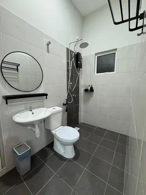 a bathroom with a toilet and a sink and a mirror at MSprivate Pool-Ipoh Perak in Ipoh