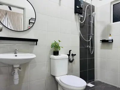 a bathroom with a toilet and a sink and a shower at MSprivate Pool-Ipoh Perak in Ipoh