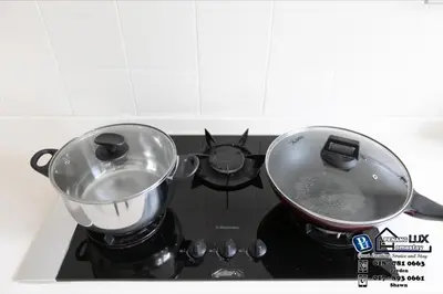a pot and a pan on top of a stove at GeorgeTown Codrington 6BR KTV BBQ Pool Bungalow 28Pax in George Town