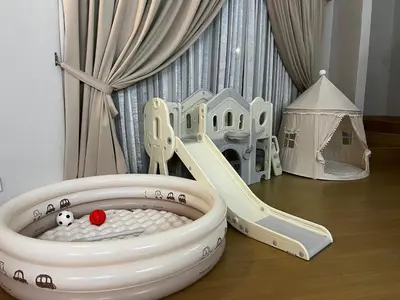 a childs play area with a dog house and a slide at GeorgeTown Codrington 6BR KTV BBQ Pool Bungalow 28Pax in George Town