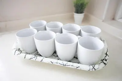 a tray of white cups on a counter at GeorgeTown Codrington 6BR KTV BBQ Pool Bungalow 28Pax in George Town