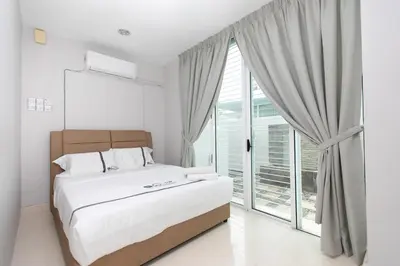 a bedroom with a bed and a large window at GeorgeTown Codrington 6BR KTV BBQ Pool Bungalow 28Pax in George Town