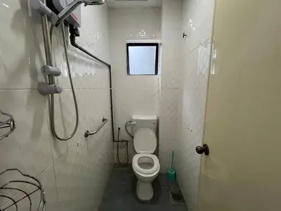 a small bathroom with a toilet and a shower at Cottage Hill -Cameron Highlands in Cameron Highlands