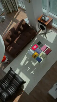a living room with a brown couch and a table at Haus in George Town