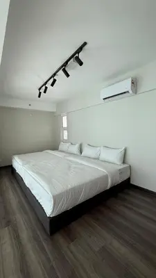 a white bedroom with a large white bed in it at Haus in George Town