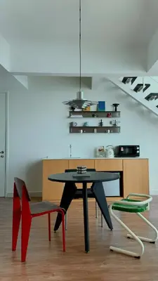 a dining room with a table and two chairs at Haus in George Town