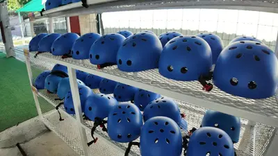 a bunch of blue helmets sitting on a shelf at Love UU Garden - Paddy View Stay with Bicycle Ride in Balik Pulau