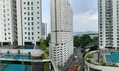 an overhead view of a city with tall buildings at Straits Garden Suites in Jelutong