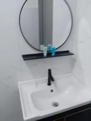 a bathroom with a sink and a mirror at Skyn 2 smartstay in Ipoh