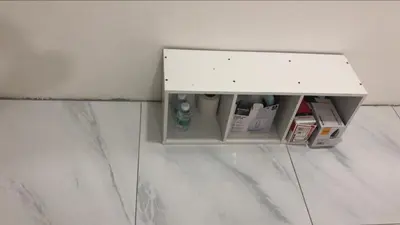 a small cabinet in the corner of a bathroom at Skyn 2 smartstay in Ipoh
