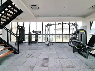 a gym with treadmills and machines in a room at CoZY FAMILY STAY GEORGETOWN 3BR -10PAX URBAN in Jelutong