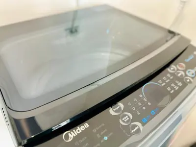 a close up of a toaster oven remote control at CoZY FAMILY STAY GEORGETOWN 3BR -10PAX URBAN in Jelutong