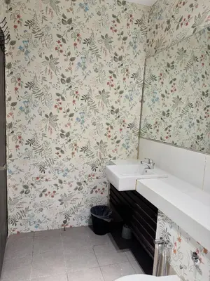 a bathroom with a sink and a mirror at 118 Island Plaza by ZenZone88 in Tanjong Tokong