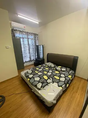 a bedroom with a bed in a room at Bright Apartment in Klebang in Ipoh