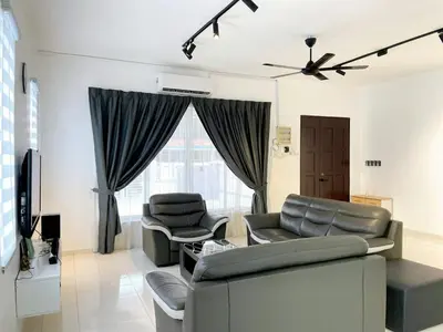 a living room with a couch and two chairs at Cozy living 2 Storey Haus 4Room10Pax-Near Icon City in Bukit Mertajam
