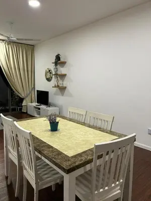 a dining room table with four white chairs and a yellow counter top at Ella Residence Homestay in Brinchang