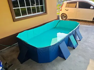 a blue ping pong table in front of a building at Syakeel Homestay Bandar Bharu, Parit Buntar & Nibong Tebal in Bandar Baharu