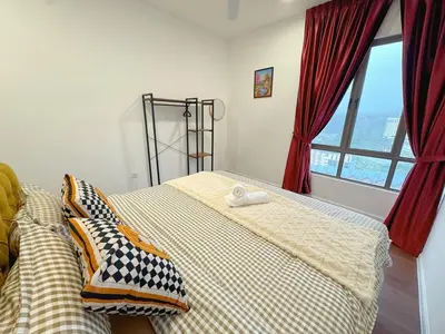 a bedroom with a bed and a window at 180View of Keafarm 7-9Pax CoolSummer at Palas Horizon in Tanah Rata