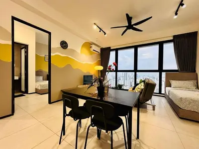 a living room with a dining room table and a plane at Home Away From Home in Penang in Jelutong