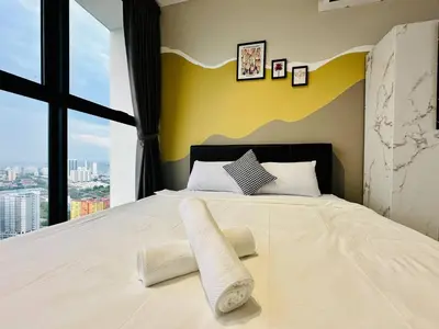 a bedroom with a large bed with a large window at Home Away From Home in Penang in Jelutong