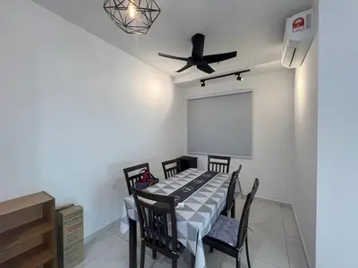 a room with a table with chairs and a ceiling fan at Di Aran Residence Penang in Simpang Ampat