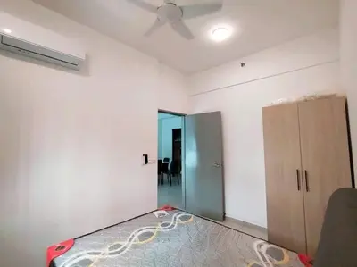 an empty room with a ceiling fan and a closet at Di Aran Residence Penang in Simpang Ampat