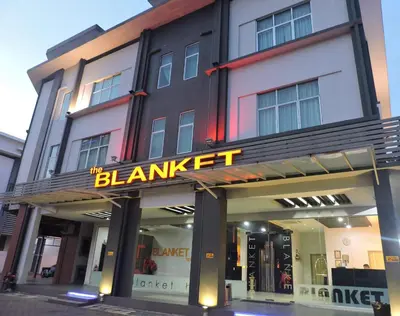 a building with a sign that reads the blancet at The Blanket Hotel Seberang Jaya in Perai