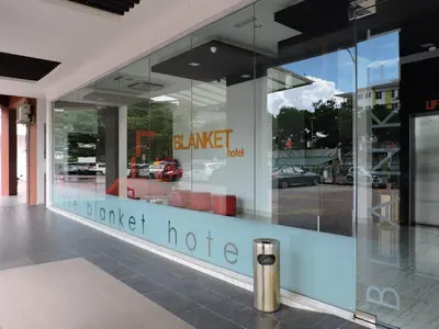 a large glass window of a car dealership at The Blanket Hotel Seberang Jaya in Perai