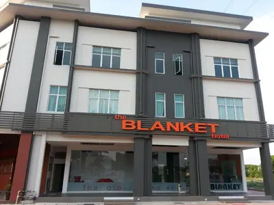 a black and white building with a sign on it at The Blanket Hotel Seberang Jaya in Perai