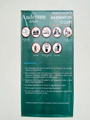 a sign that is posted on the side of a building at Aiqa homestay in Ipoh