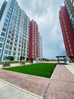 a park in front of two tall buildings at Aiqa homestay in Ipoh