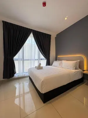 a bedroom with a large bed and a large window at Maca Hotel by Sky Hive in George Town