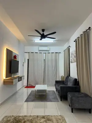 a living room with a couch and a ceiling fan at \u4f11\u95f2\u4f18\u6c11\u5bbf in Sitiawan