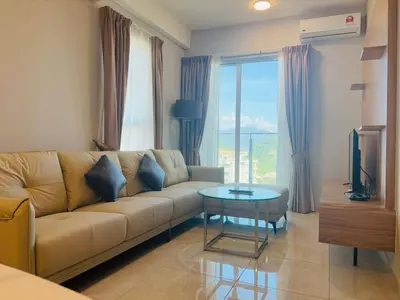 a living room with a couch and a table at Wyndham Garden Suites IPOH ICC in Ipoh