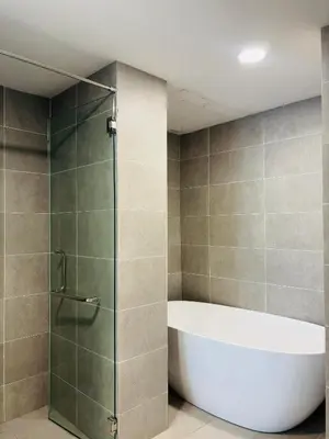 a bathroom with a bath tub and a shower at Wyndham Garden Suites IPOH ICC in Ipoh