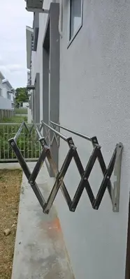 a metal object attached to the side of a building at Suria Aman Homestay Semi-D 5 Rooms 5 Bathrooms in Taiping