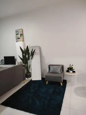 a living room with a couch and a chair at AzzSpacesAnderson in Ipoh
