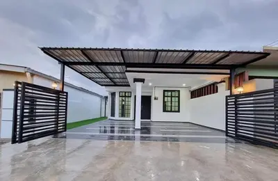 an open garage with awning in a house at Rania Homestay Tasek Gelugor in Padang Chempedak